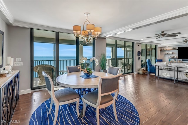 dining area with expansive windows, plenty of natural light, a water view, and dark wood-type flooring