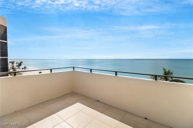 balcony with a view of the beach and a water view