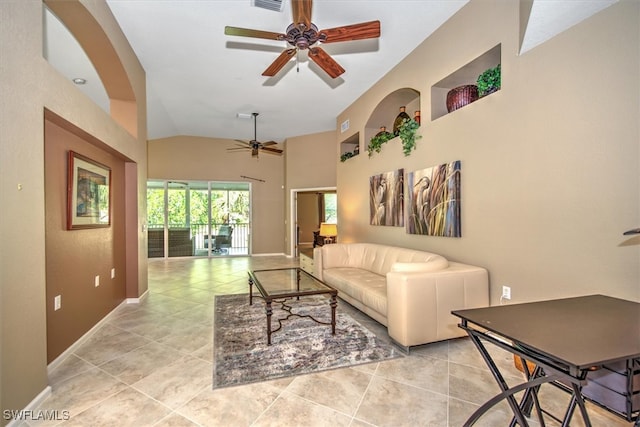 tiled living room featuring high vaulted ceiling and ceiling fan