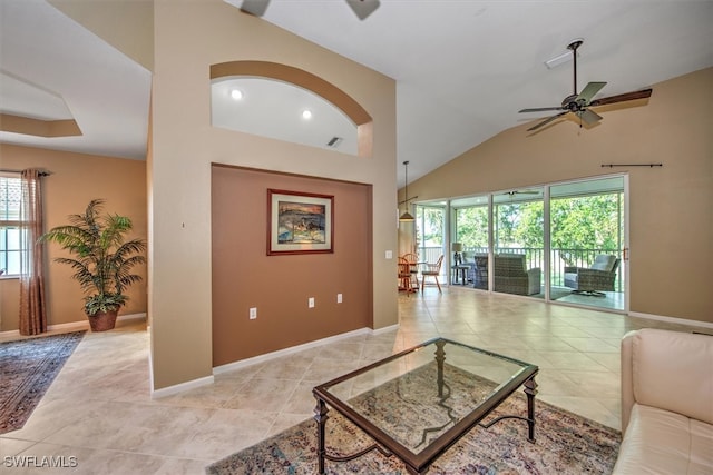 tiled living room with vaulted ceiling and ceiling fan