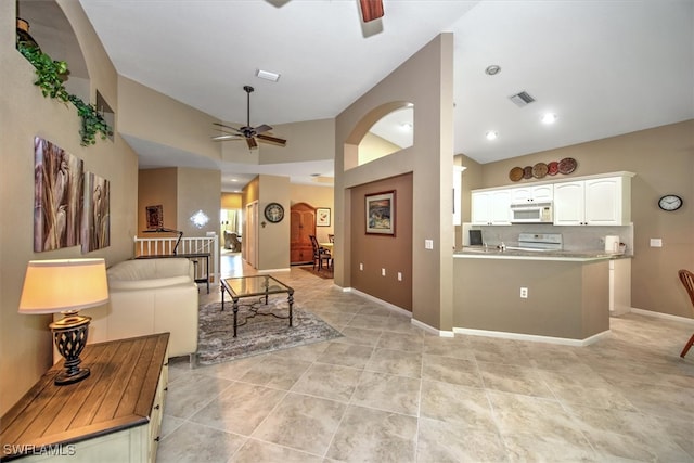 living room with ceiling fan and light tile patterned floors