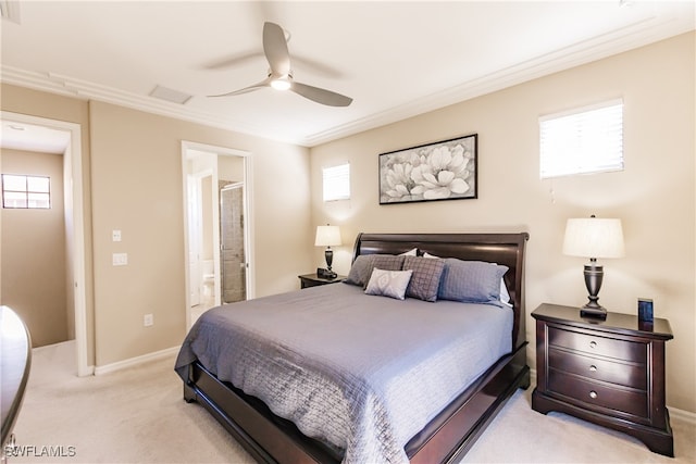 carpeted bedroom with ceiling fan, connected bathroom, and multiple windows