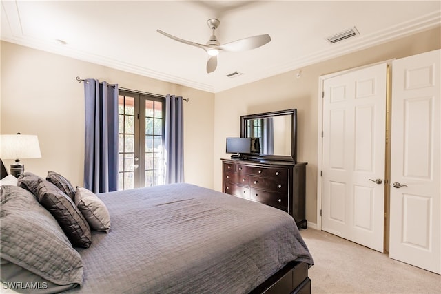 bedroom featuring ceiling fan, light carpet, and french doors