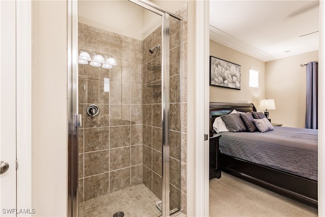 bathroom with a shower with door