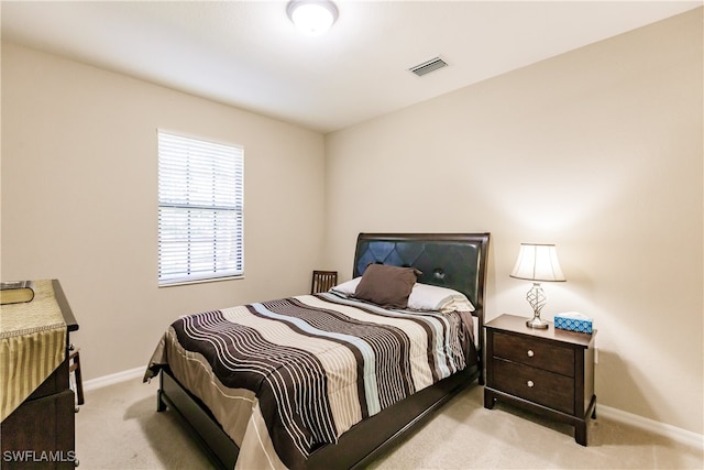 bedroom featuring light colored carpet