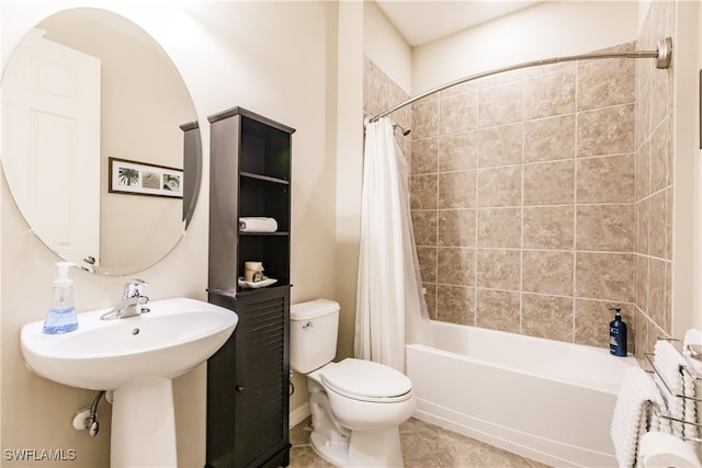 bathroom with tile patterned flooring, shower / tub combo, and toilet