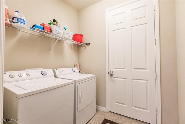 9028 Alturas St Unit 3204, Naples, FL 34113 - washroom featuring washing machine and dryer, baseboards, and light tile patterned floors