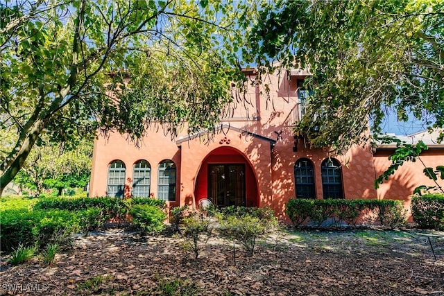 9028 Alturas St Unit 3204, Naples, FL 34113 - mediterranean / spanish home featuring french doors and stucco siding