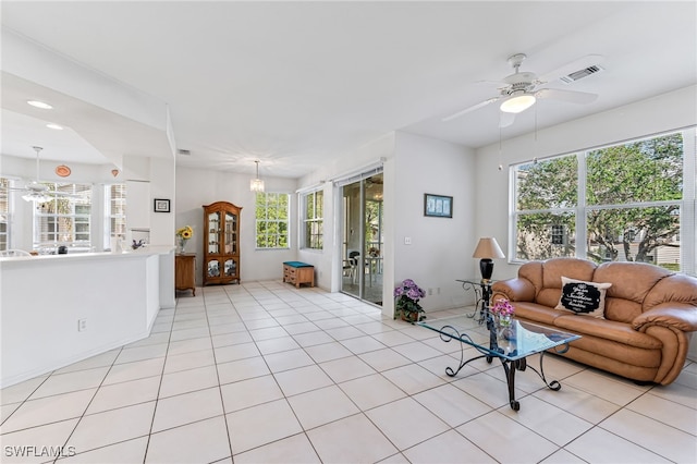 tiled living room featuring ceiling fan