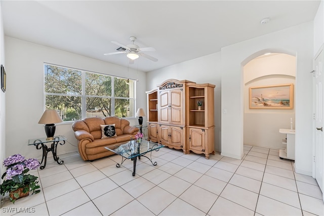 tiled living room featuring ceiling fan