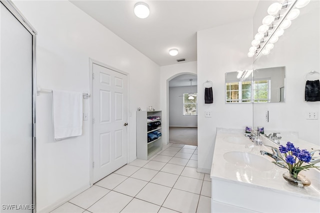 bathroom with tile patterned flooring and vanity