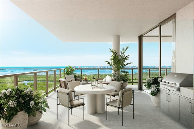 5100 Baybridge Blvd Unit 1601, Estero, FL 33928 - balcony featuring a water view and an outdoor kitchen