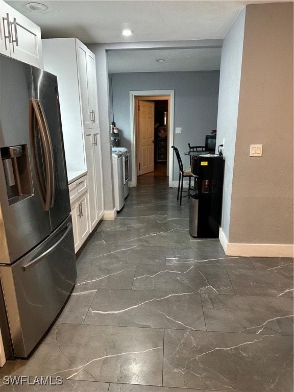 kitchen featuring white cabinetry and appliances with stainless steel finishes