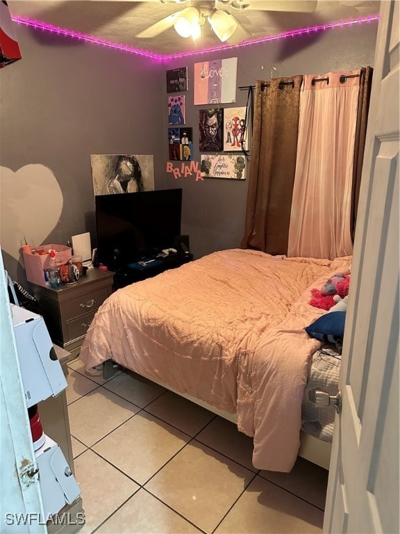 bedroom featuring ceiling fan and tile patterned flooring