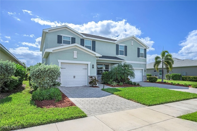 front of property featuring a garage and a front yard