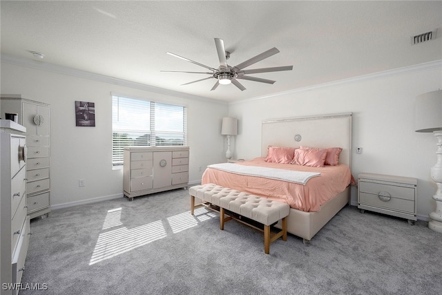 bedroom featuring ceiling fan, carpet floors, and ornamental molding