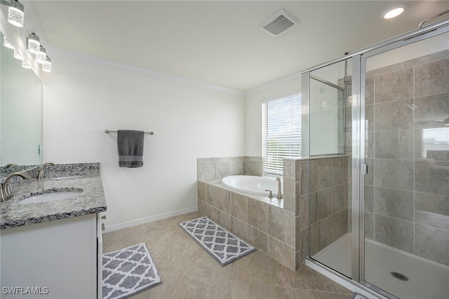 bathroom with vanity, crown molding, tile patterned flooring, and plus walk in shower