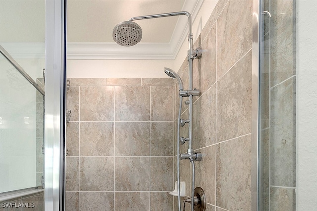 bathroom with a shower with door