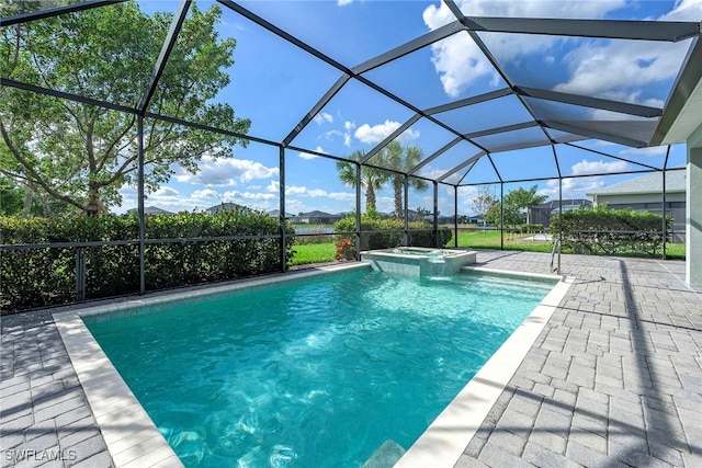 view of pool with a patio area, a lanai, and an in ground hot tub