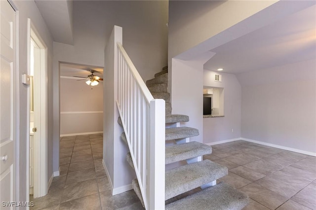 staircase with ceiling fan