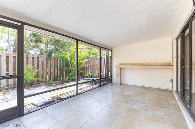 unfurnished sunroom featuring a healthy amount of sunlight