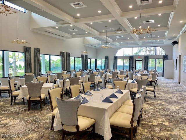 carpeted dining area featuring beamed ceiling, coffered ceiling, visible vents, and a towering ceiling