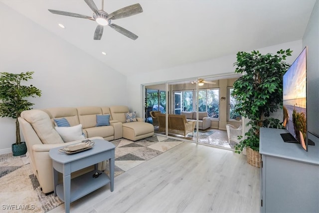 living room featuring recessed lighting, lofted ceiling, light wood-style floors, and a ceiling fan