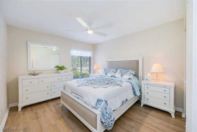 bedroom with a ceiling fan, light wood-style floors, and baseboards