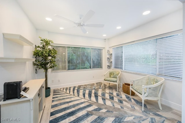 living area featuring recessed lighting, baseboards, and ceiling fan