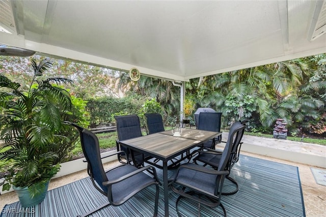 wooden terrace with outdoor dining area and a patio area