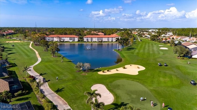 aerial view with view of golf course and a water view