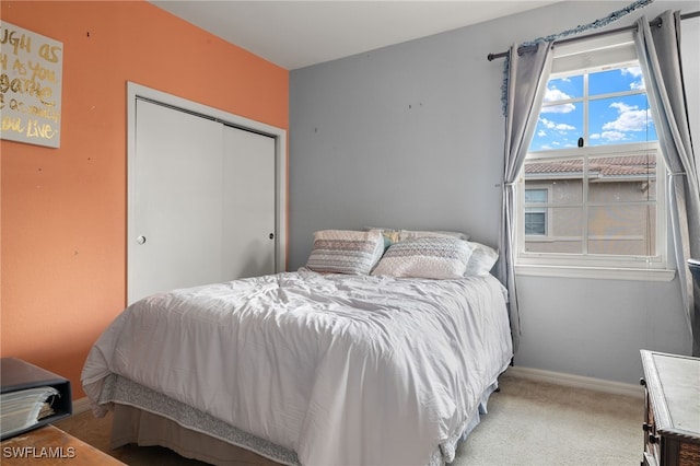 bedroom with a closet and carpet floors