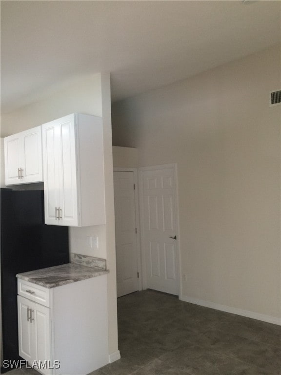 kitchen featuring white cabinets