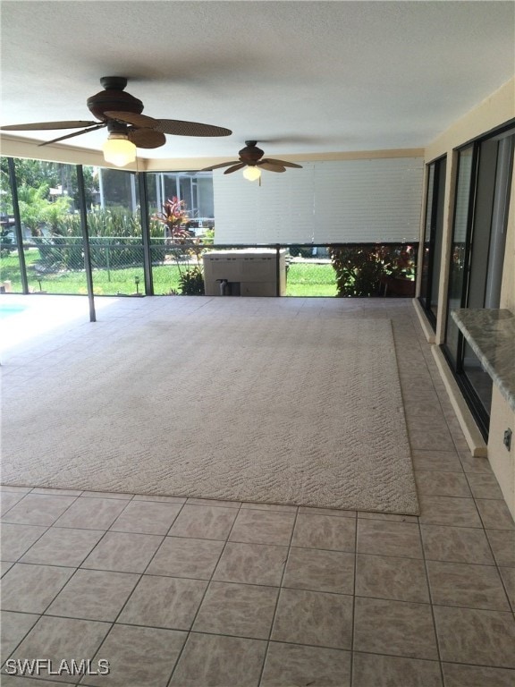 view of patio with ceiling fan