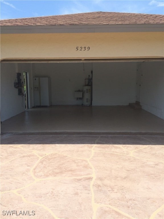 garage featuring electric water heater