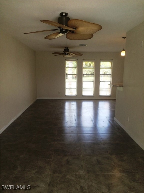 empty room featuring ceiling fan