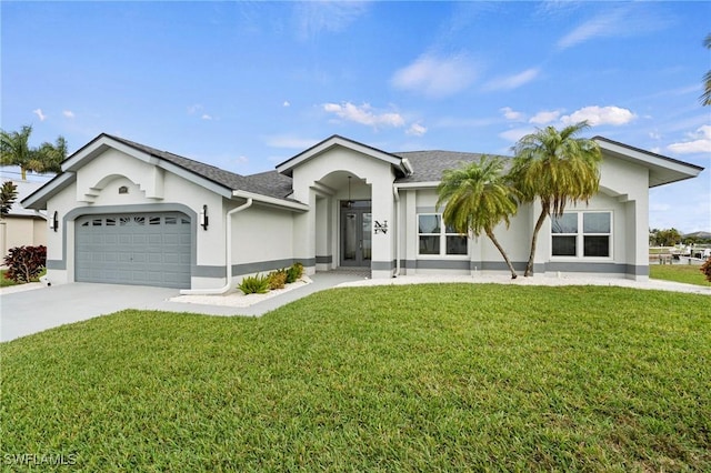 ranch-style home featuring a garage and a front lawn