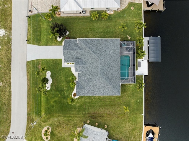 birds eye view of property featuring a water view