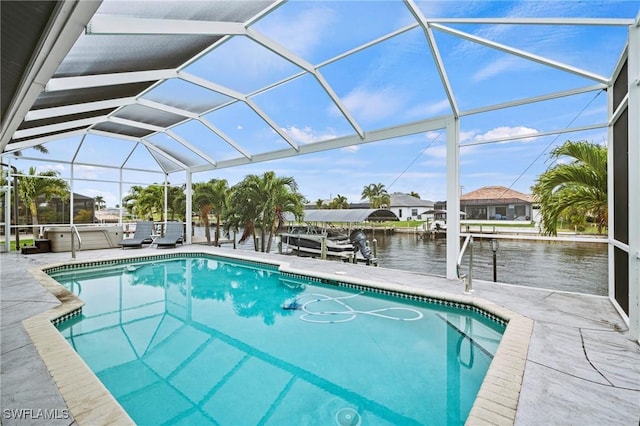 view of swimming pool with a jacuzzi, a patio, glass enclosure, and a water view