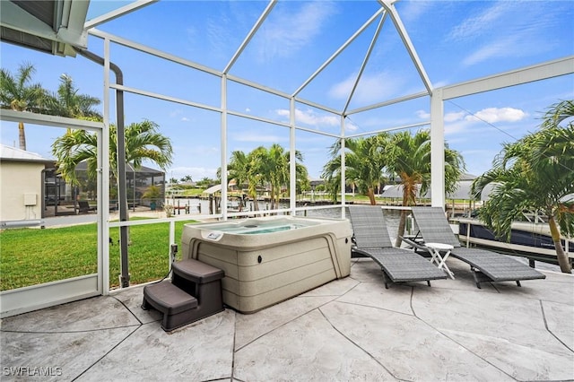 sunroom / solarium with a jacuzzi and a healthy amount of sunlight