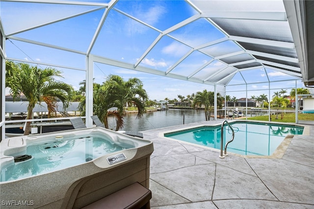 view of swimming pool with an outdoor hot tub, glass enclosure, a water view, and a patio