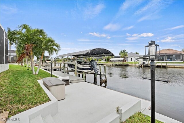 view of dock with a lanai, a water view, and a yard