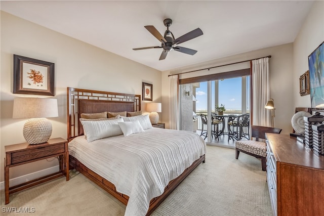 bedroom featuring ceiling fan, access to exterior, and light carpet