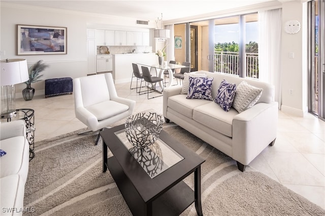 tiled living room with ornamental molding