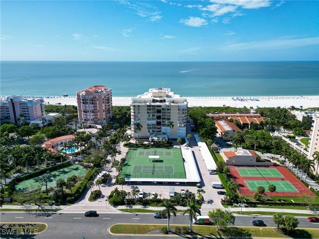 bird's eye view with a water view and a view of the beach