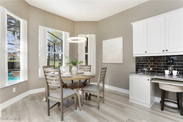 dining space featuring light hardwood / wood-style floors