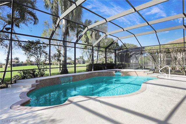 view of pool featuring glass enclosure and a patio area