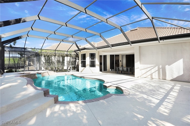 view of pool with a patio and a lanai