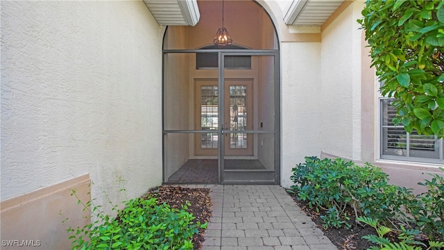 entrance to property featuring french doors