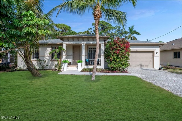 view of front of house featuring a porch, a garage, and a front yard